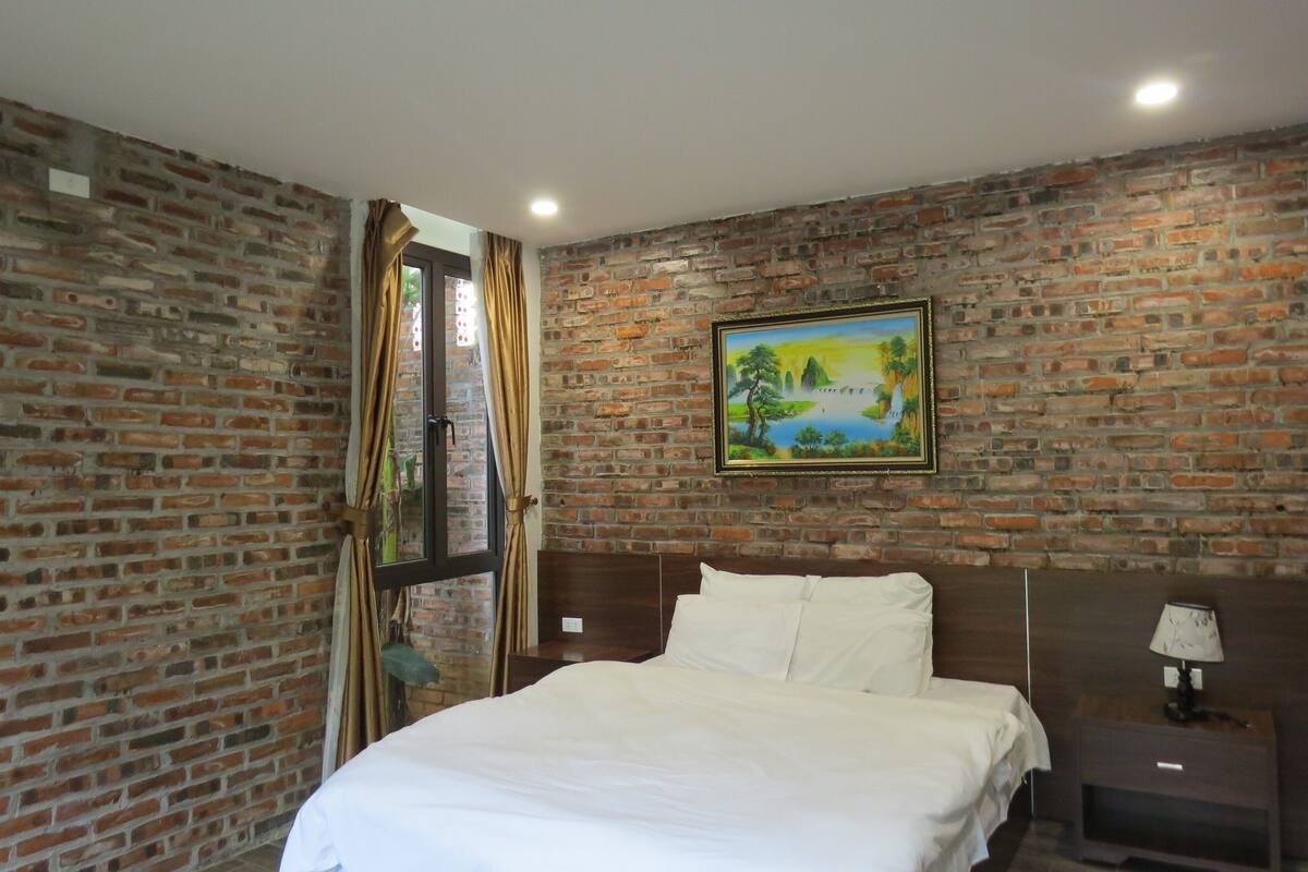 Garden View Room | 1 bedroom, desk, laptop workspace, blackout drapes