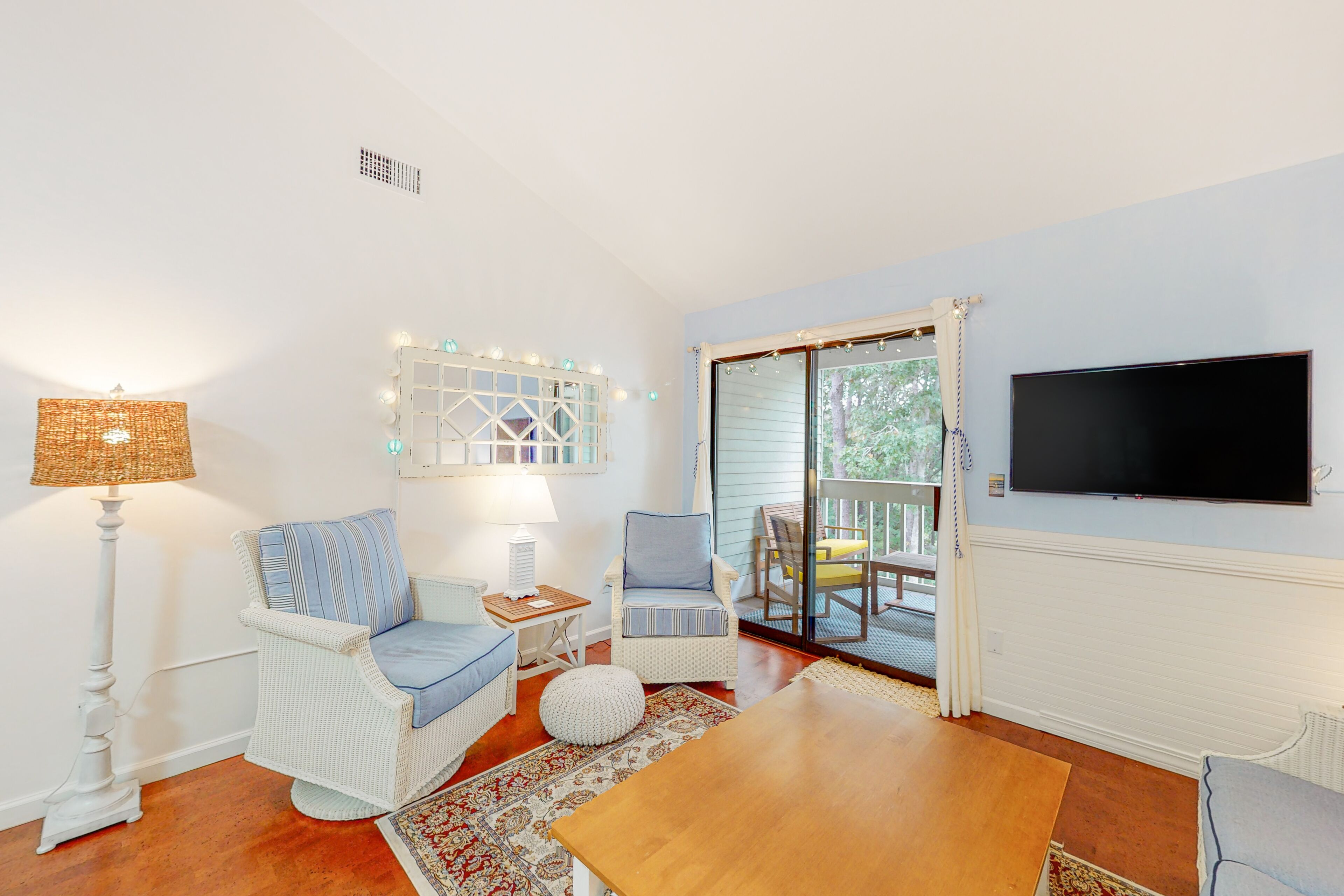 Charming second-floor retreat with a full kitchen and balcony view