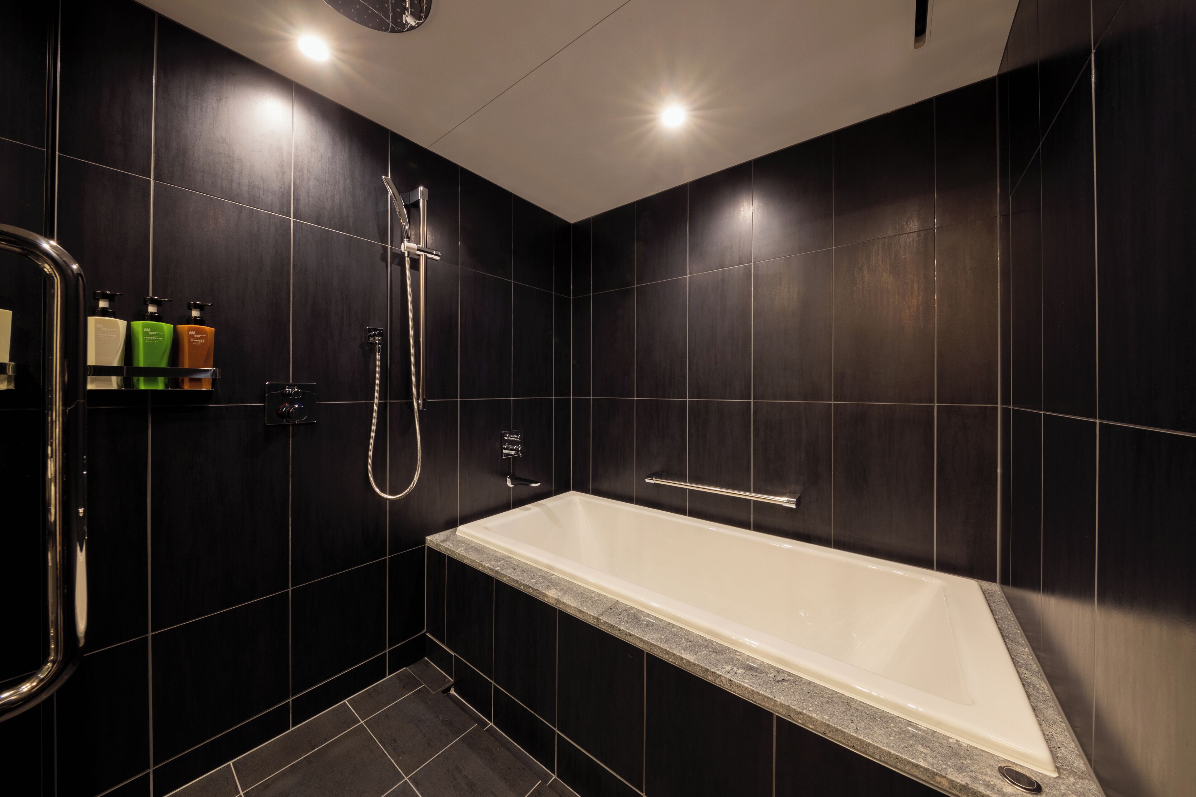 suite | bathroom | separate bathtub and shower, rainfall showerhead, free toiletries