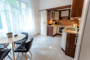 Classic Apartment, 3 Bedrooms | Private kitchen | Full-sized fridge, microwave, oven, stovetop