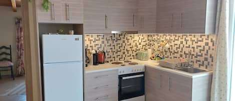 Chrysianna Seaview Apartment | Private kitchen | Full-size fridge, oven, stovetop, espresso maker