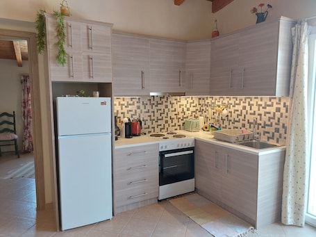 Chrysianna Seaview Apartment | Private kitchen | Full-size fridge, oven, stovetop, espresso maker