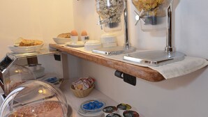 A breakfast buffet with various food items and condiments. - Relais Sweet Days (Peschiera del Garda)
