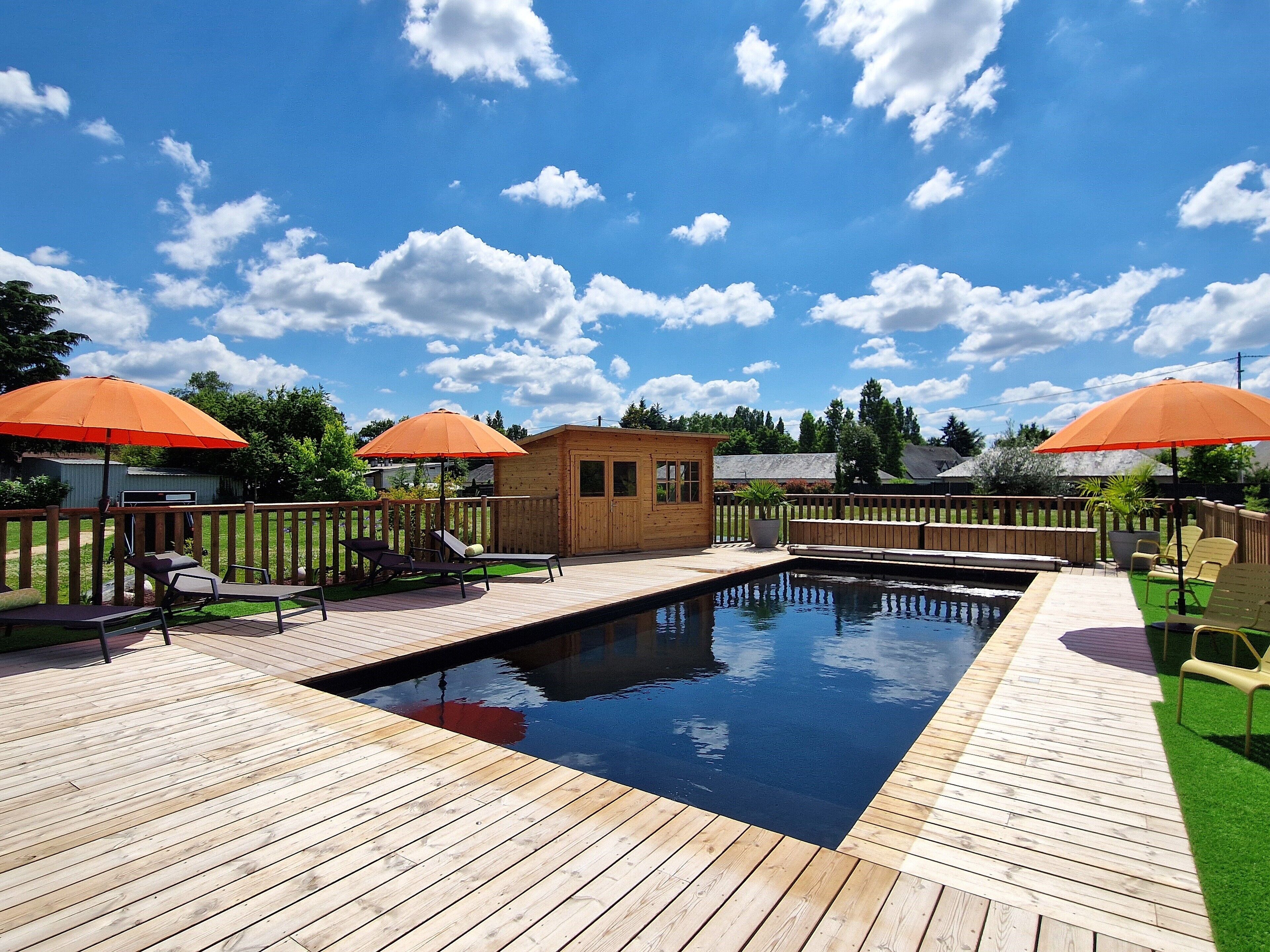 seasonal outdoor pool, open 10:00 am to 7:00 pm, pool umbrellas