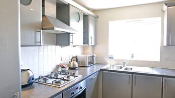 Apartment | Private kitchen | Full-size fridge, microwave, oven, stovetop