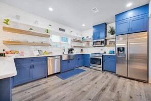 Enjoy cooking in this well-equipped kitchen with a dishwasher, microwave, stove, and refrigerator.