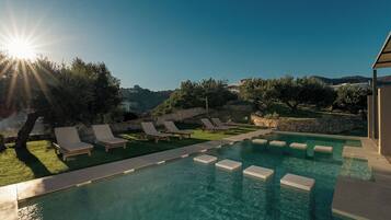 Serenity Junior Suite Garden view Shared Pool | In-room safe, desk, soundproofing, iron/ironing board