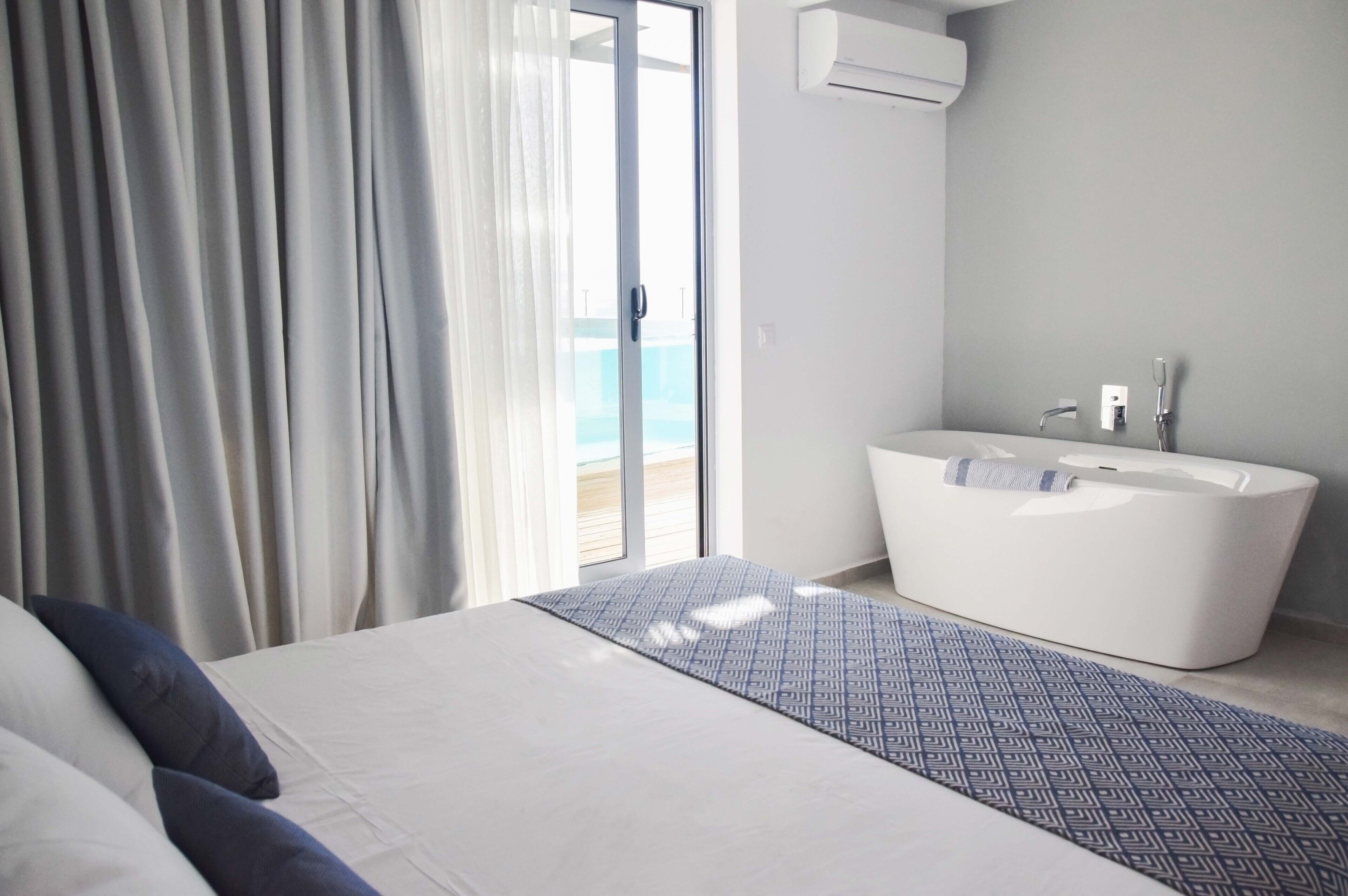 Suite, Private Pool, Sea View | In-room safe, desk, soundproofing, iron/ironing board