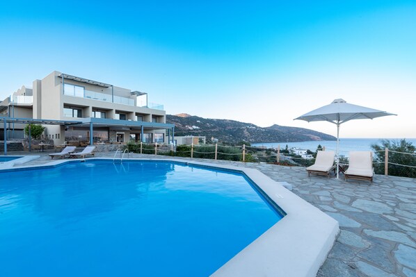 Seasonal outdoor pool, pool loungers