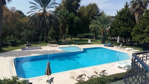 Seasonal outdoor pool, pool umbrellas, pool loungers