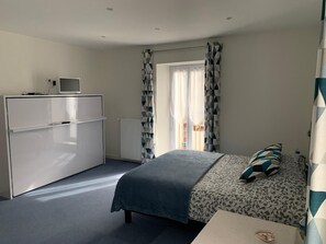 Family Room, 2 Queen Beds | Iron/ironing board, free cribs/infant beds, free WiFi, bed sheets