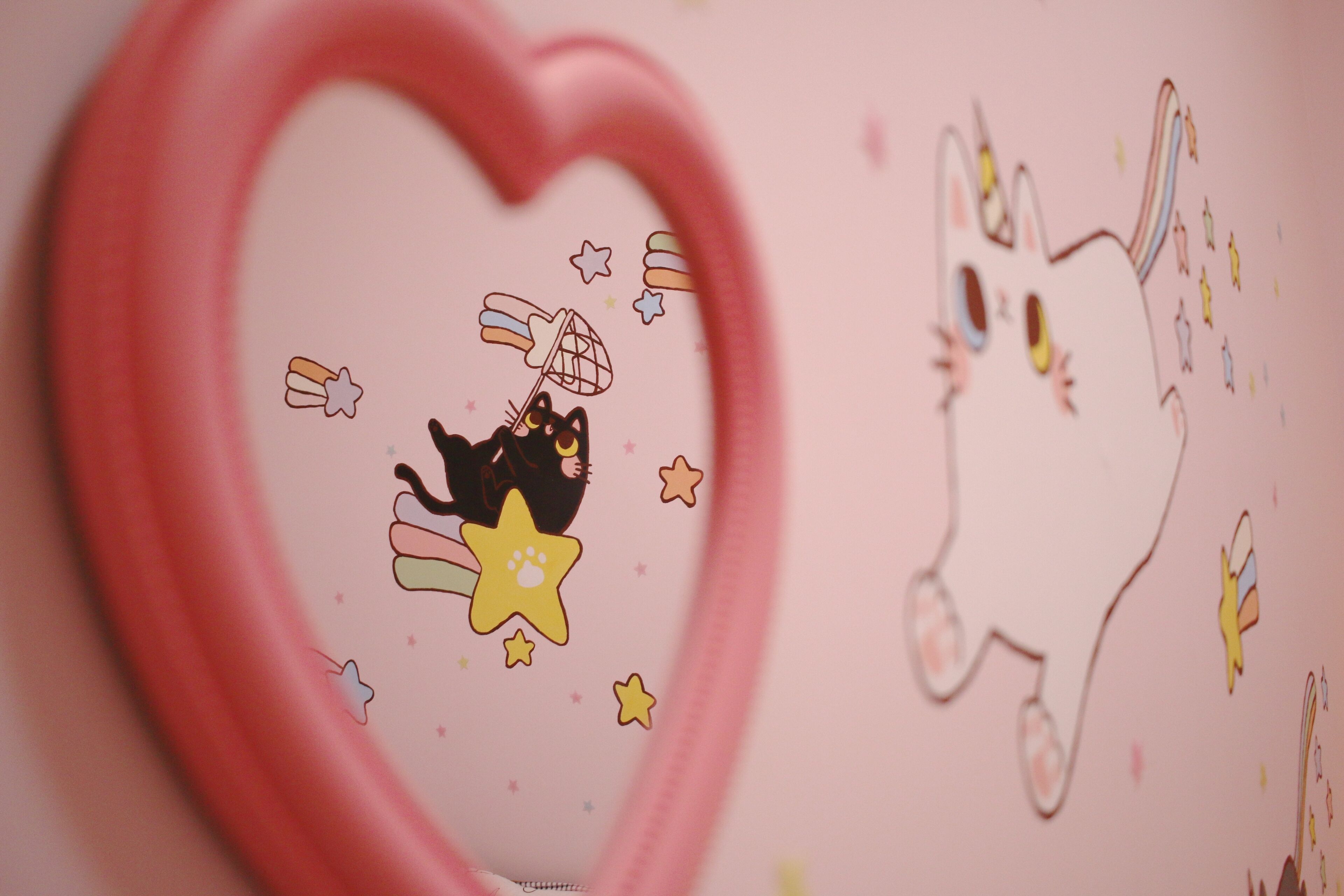 A heart-shaped object with a cartoon character and stars.