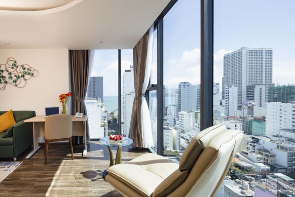 Senior Room, City View | Living area | 35-inch TV with digital channels, fireplace - Amber Hotel (Nha Trang)