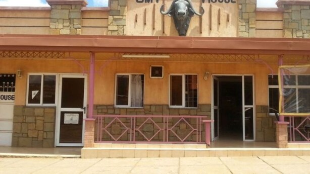 A building with a sign reading "House" and a bull statue above the entrance. - GMT Guest House (Mai Mahiu)