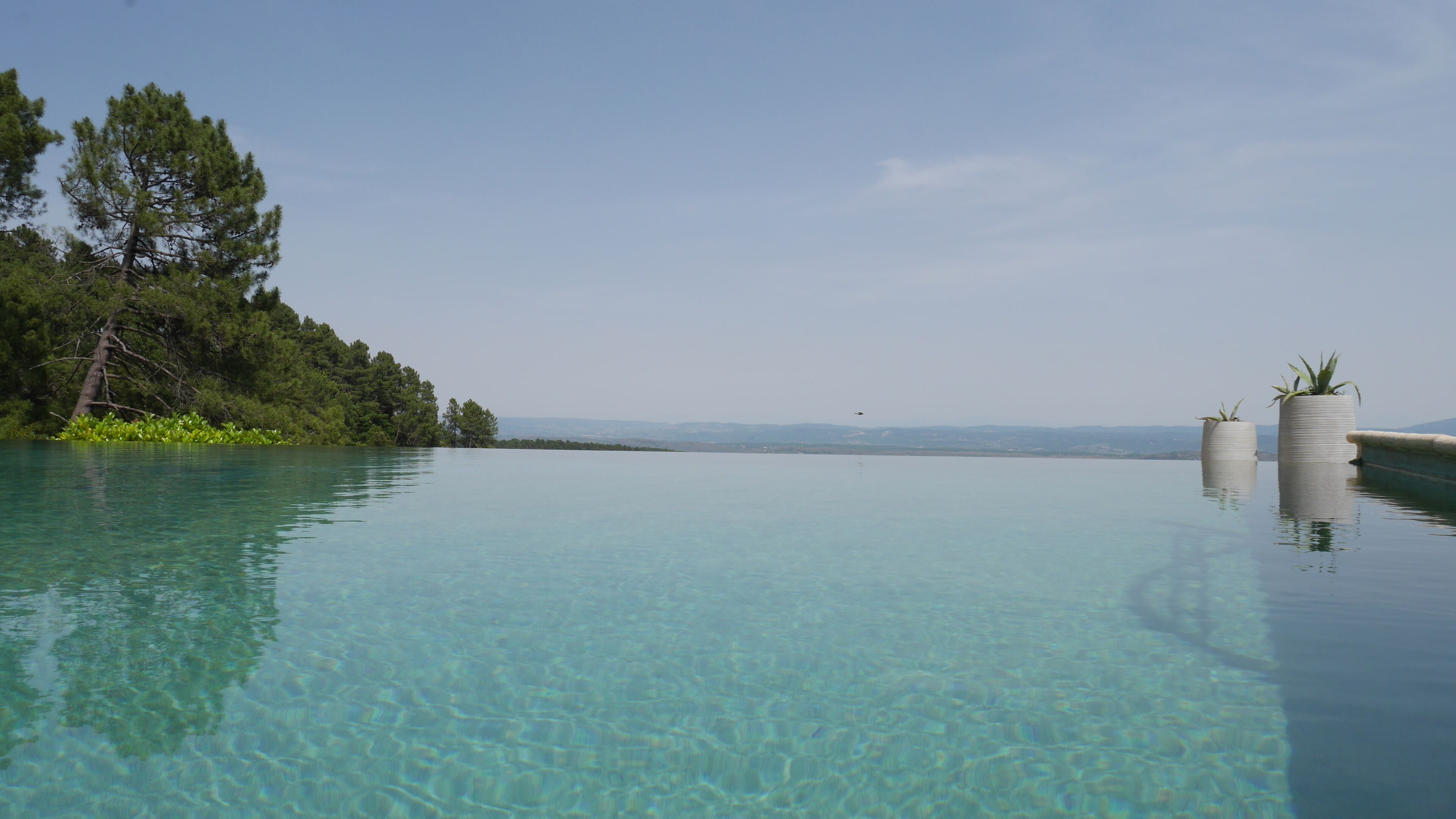 Seasonal outdoor pool, a heated pool, pool umbrellas, pool loungers