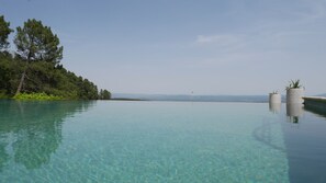 Seasonal outdoor pool, a heated pool, pool umbrellas, sun loungers