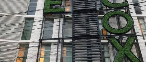 A building with a sign that reads 'GRACE COX'.