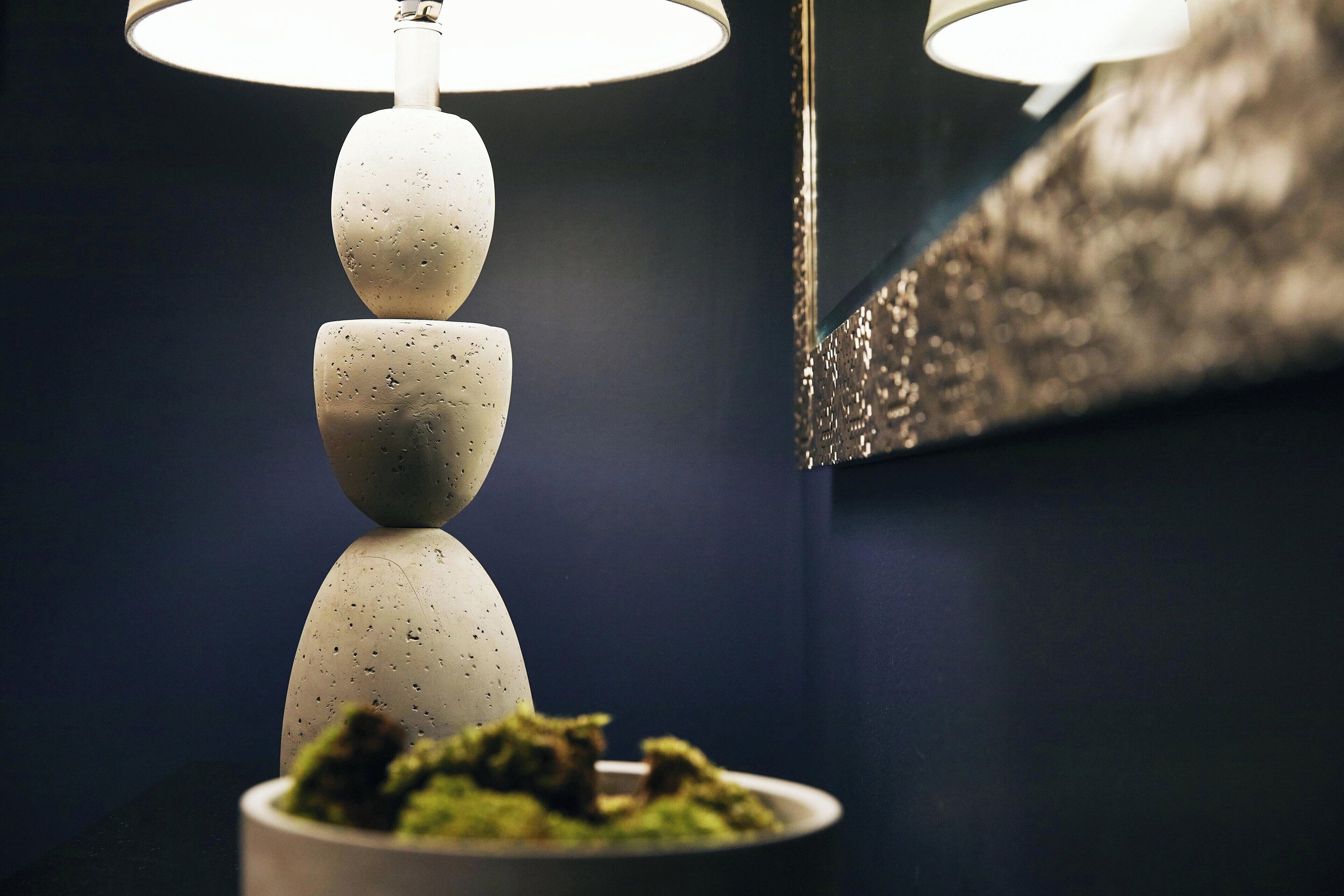 A modern lamp with a unique design featuring stacked spherical elements.