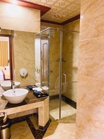 Shower, free toiletries, hair dryer, slippers