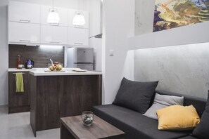 Appartement Deluxe, 1 chambre | Aire de séjour | Téléviseur à écran plat