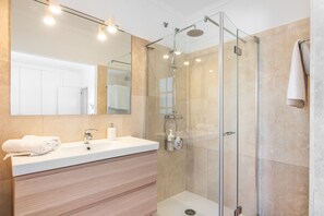 Bathtub, hair dryer, towels, soap