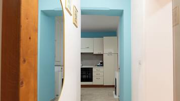 Suíte família | Cozinha privada | Máquina de café expresso, cafeteira/chaleira, chaleira elétrica