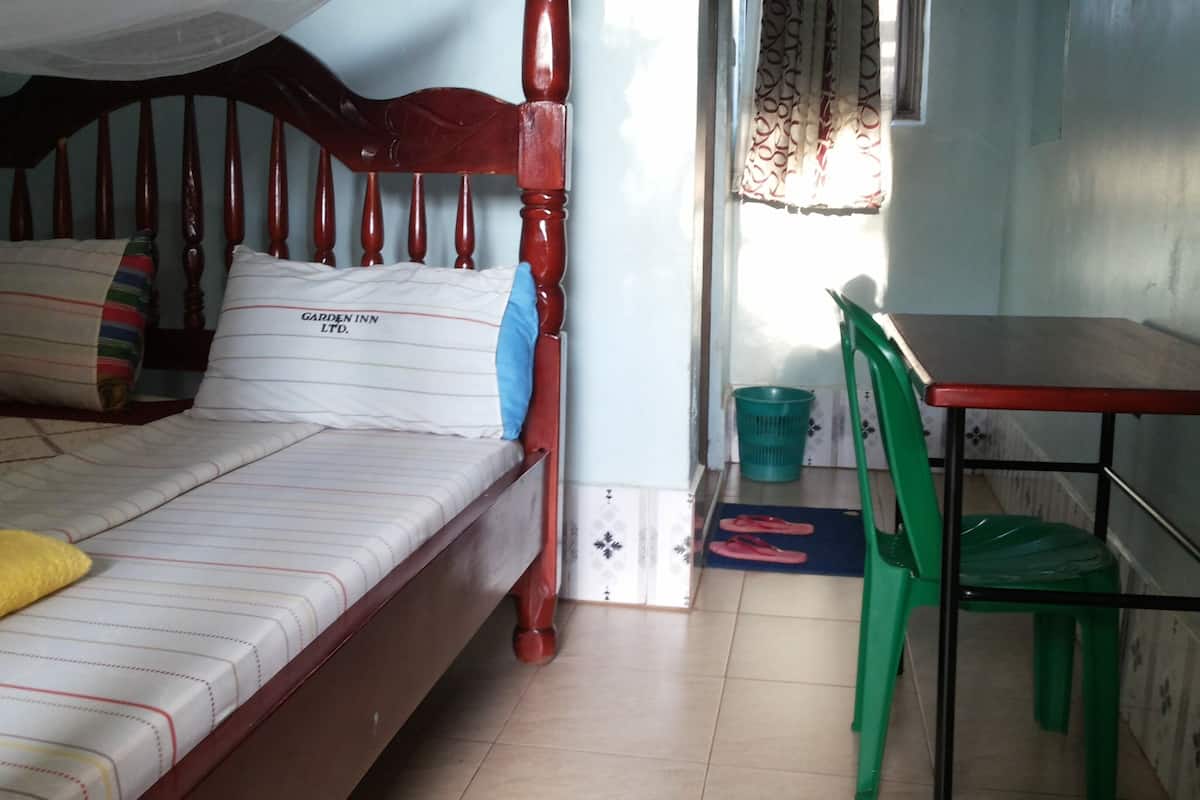 Desk, laptop workspace, individually furnished, bed sheets