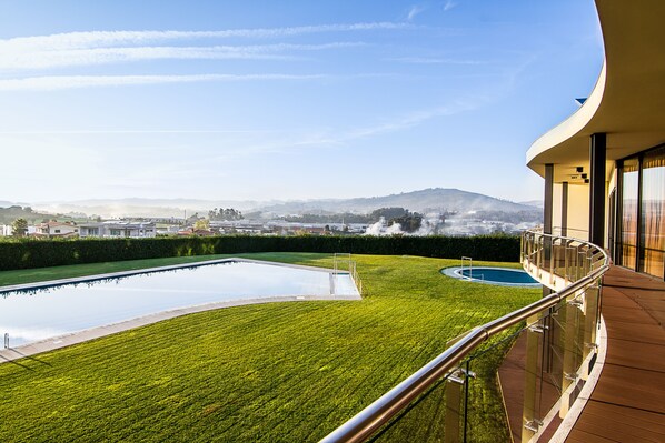 2 indoor pools, seasonal outdoor pool, pool umbrellas, pool loungers