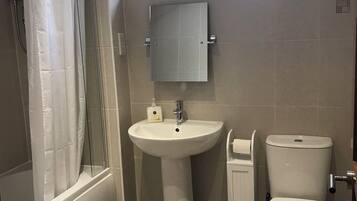 Combined shower/bathtub, hair dryer, towels, soap