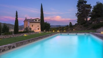 Seasonal outdoor pool, open 11:00 AM to 8:00 PM, pool umbrellas