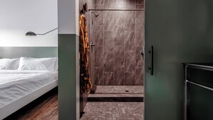 A modern bathroom with a shower, a toilet, and a sink. - Mellow Moon Lodge (Del Norte)