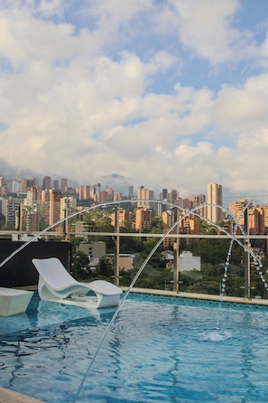 Outdoor pool, open 8:00 AM to 7:00 PM, sun loungers
