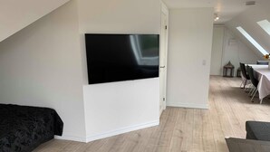 Family Apartment | Living area | 55-inch Smart TV with cable channels, TV, video-game console - Fishermans House (Hirtshals)