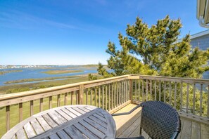 A wooden deck with a view of a water body and trees. - Island In The Sun - 3BR Townhouse with Ocean & Sound Views! (North Topsail Beach)