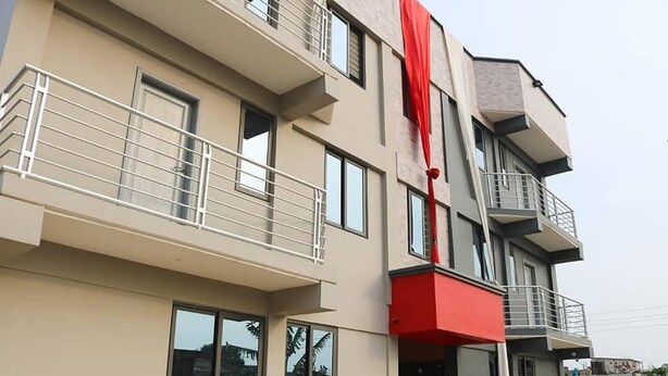 A multi-story building with balconies and large windows. - Kadny Court by Citi Apartments (Dansoman)