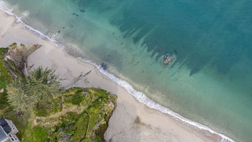 On the beach, sun loungers, beach umbrellas, beach towels