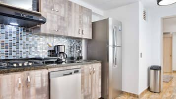 Luxury Apartment | Private kitchen | Full-sized fridge, microwave, stovetop, dishwasher