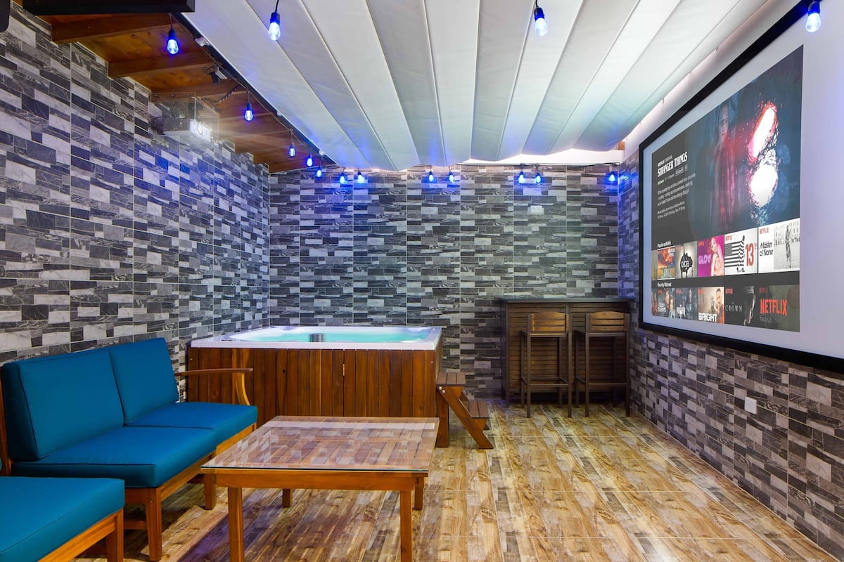 Luxury Apartment | Living area | Flat-screen TV