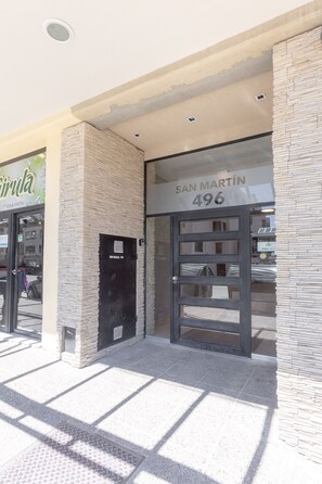 Enter through the glass door into a welcoming space.