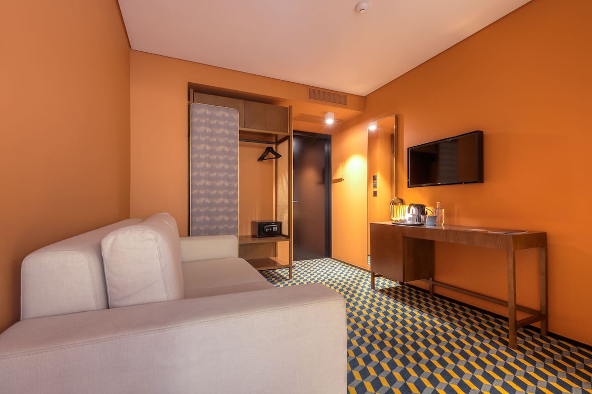 Superior Suite | Living area | Flat-screen TV