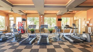 A gym with treadmills, stationary bikes, and other fitness equipment. - Vacation worthy Gilbert resort setting (Mesa)