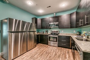 House, Multiple Beds, Patio | Private kitchen | Full-size fridge, microwave, oven, stovetop - Together Resorts 9th Ave Resort Unit B (Myrtle Beach)