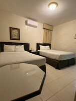 Basic Quadruple Room | Desk, laptop workspace, blackout drapes, iron/ironing board