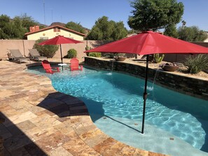 A heated pool, pool umbrellas
