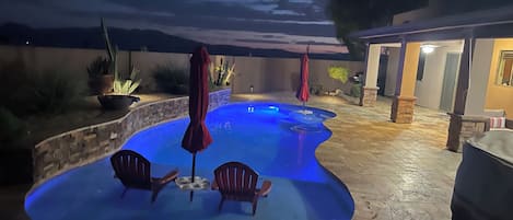 A heated pool, pool umbrellas