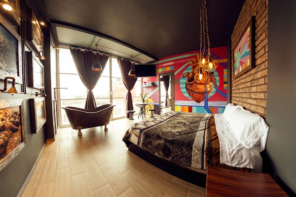 Suite, 1 King Bed, Balcony | In-room safe, iron/ironing board, free WiFi, bed sheets