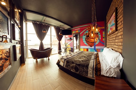 Suite, 1 King Bed, Balcony | 1 bedroom, in-room safe, iron/ironing board, free WiFi