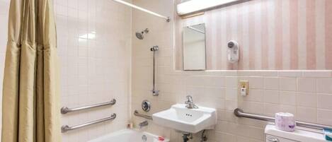 A bathroom with a bathtub, a sink, a toilet, and a shower.