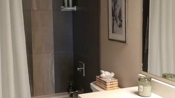Combined shower/tub, hair dryer, towels, soap