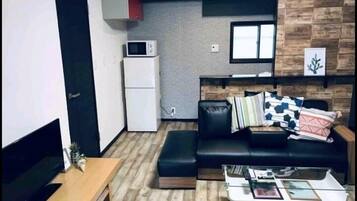 Plum Ark Apartment 205 | Living area | Flat-screen TV